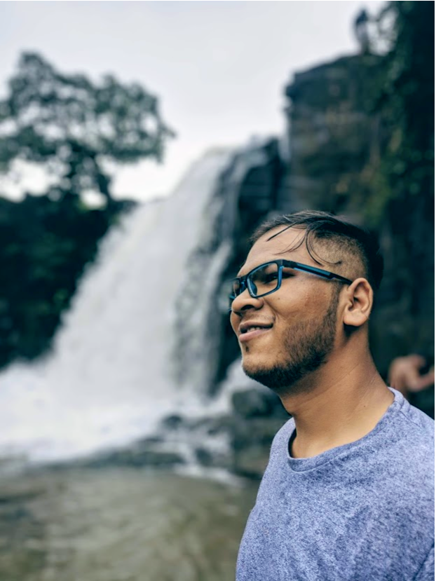 A man nearby waterfall.